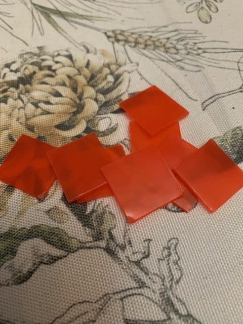 red wax squares on a table