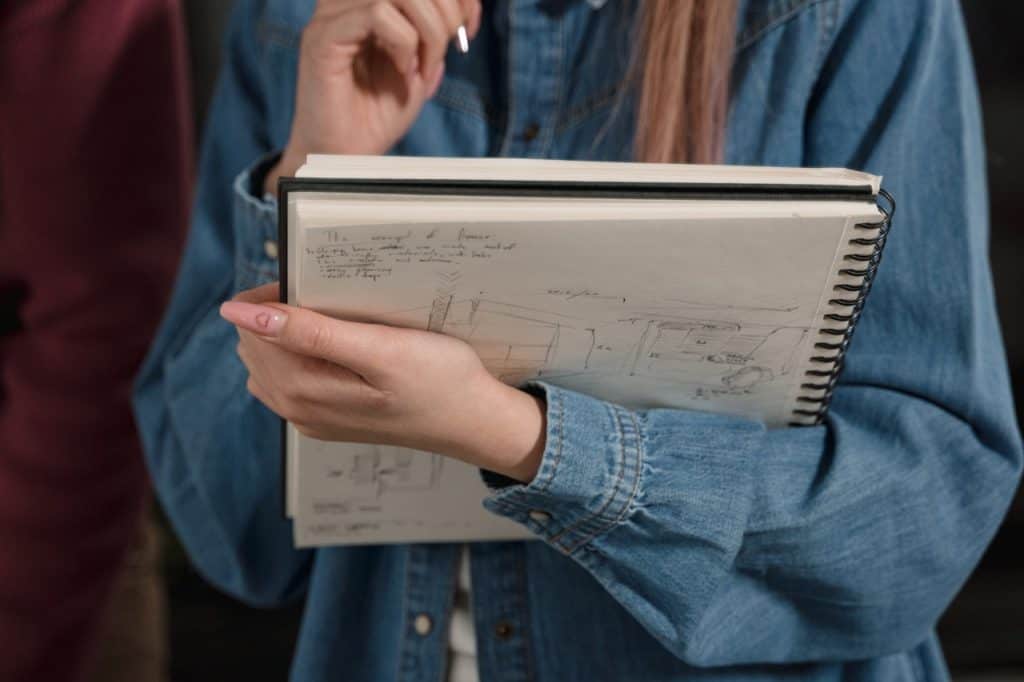 woman holding a sketch pad